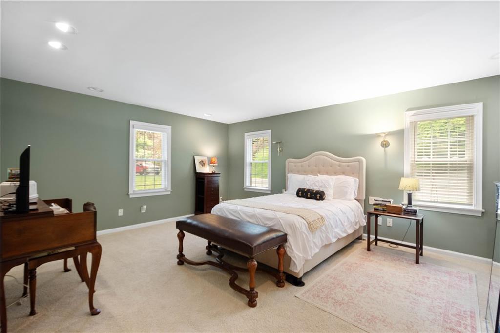 1580 Williamsburg Road Pittsburgh, PA 15243 - Photo 18 of 41 a spacious bedroom with a bed and a window