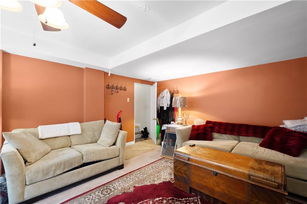 1580 Williamsburg Road Pittsburgh, PA 15243 - Photo 23 of 41 a living room with furniture and a large window