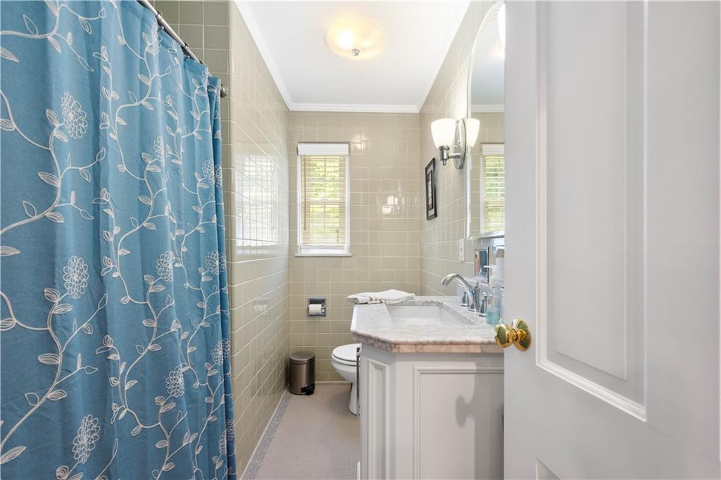 1580 Williamsburg Road Pittsburgh, PA 15243 - Photo 28 of 41 a bathroom with a sink a toilet and shower