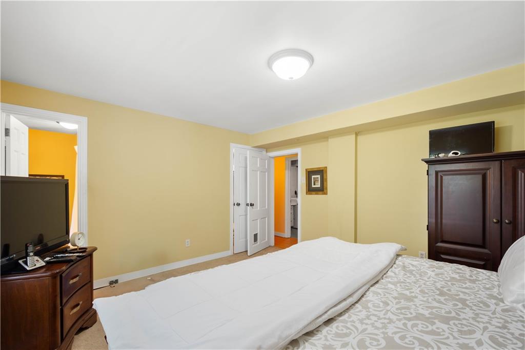 1580 Williamsburg Road Pittsburgh, PA 15243 - Photo 29 of 41 a bedroom with a bed and a flat screen tv