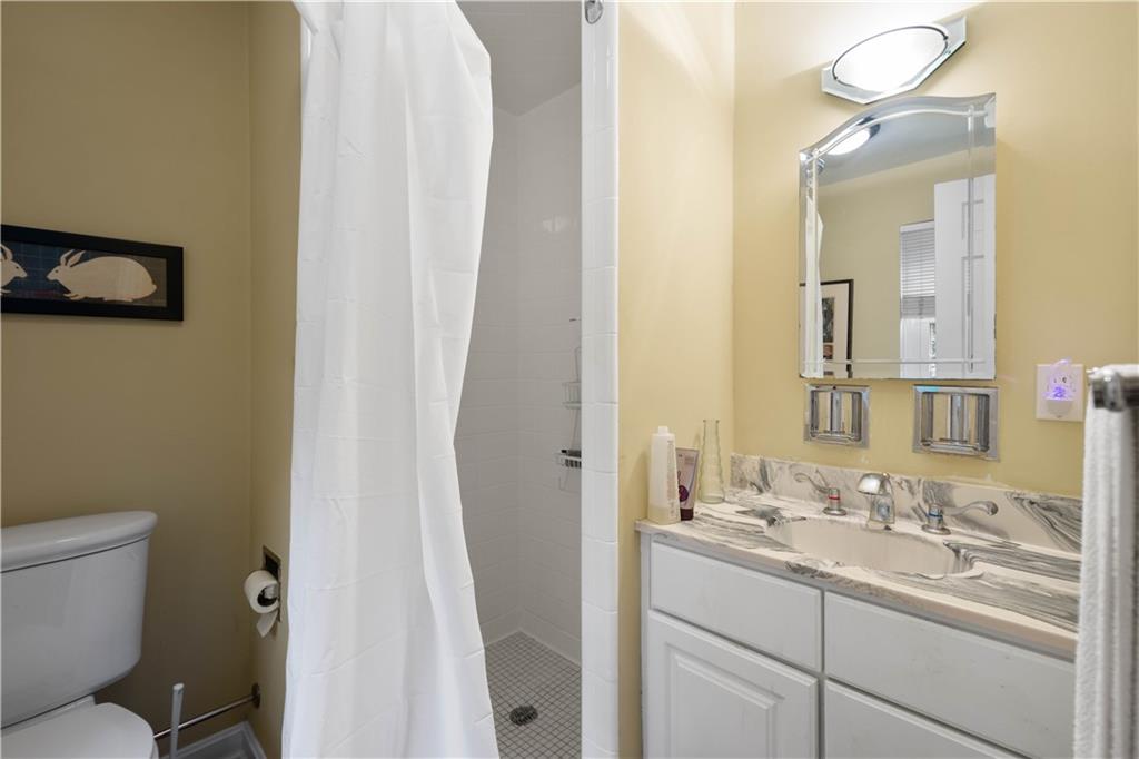 1580 Williamsburg Road Pittsburgh, PA 15243 - Photo 30 of 41 a bathroom with a sink a toilet and a mirror
