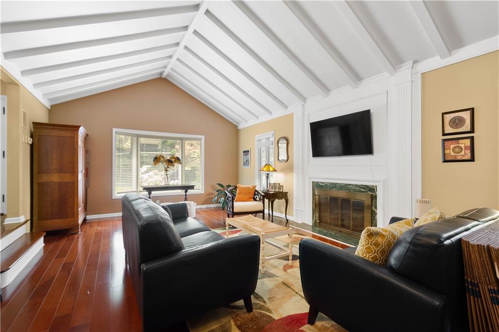 1580 Williamsburg Road Pittsburgh, PA 15243 - Photo 5 of 41 a living room with furniture a fireplace and a flat screen tv