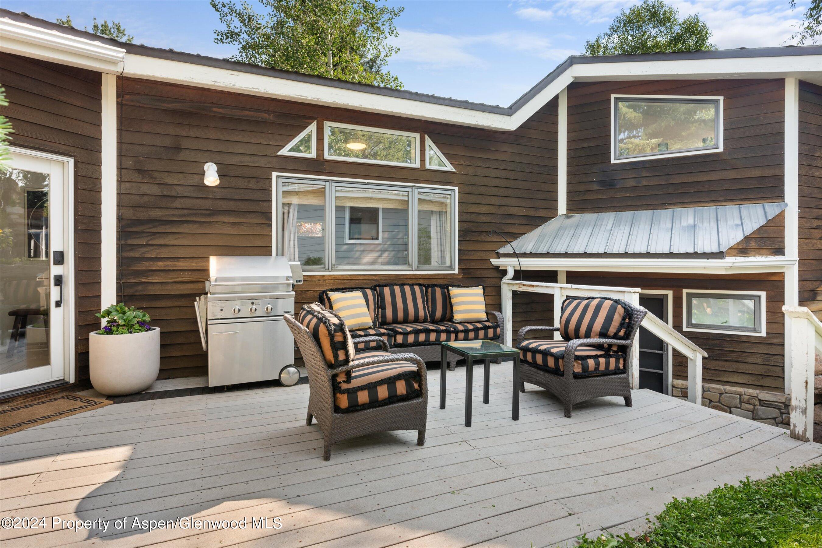 140 Maple Lane Aspen, CO 81611 - Photo 33 of 37 a view of a patio with table and chairs and potted plants