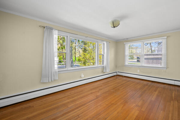 129 Belmont Road West Harwich, MA 02671 - Photo 11 of 27 a view of an empty room with wooden floor and a window