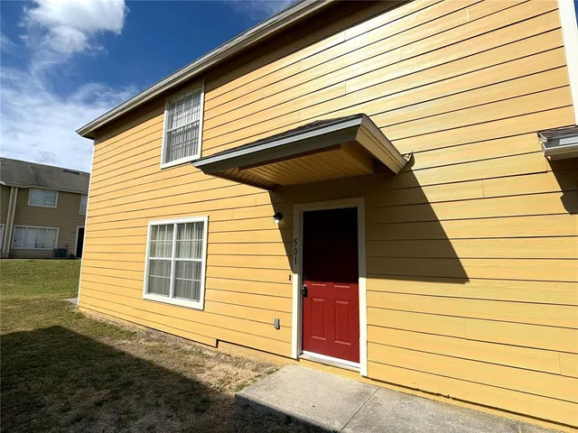 a view of a house with a street