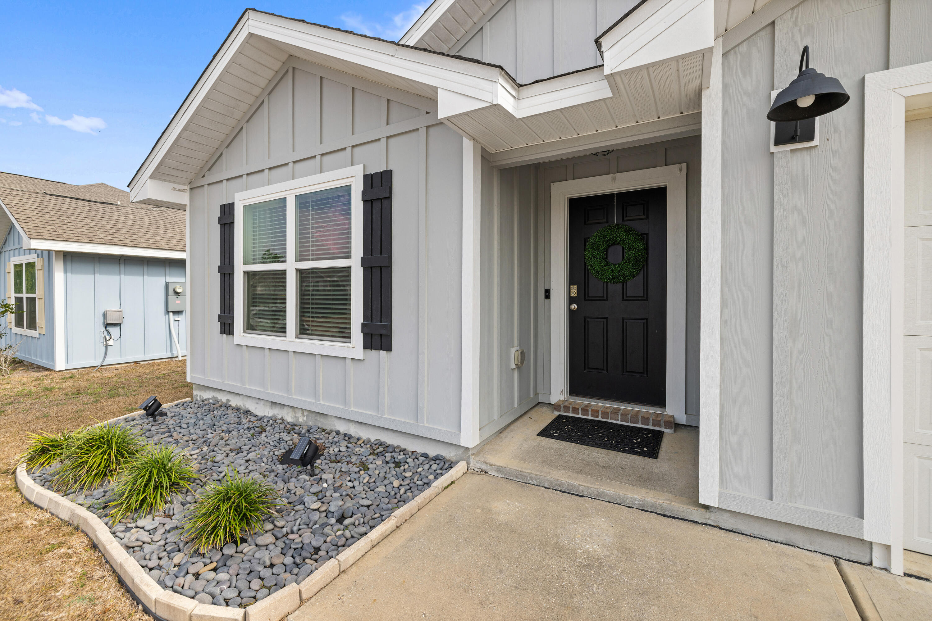 211 Laurel Hill Street Crestview, FL 32539 - Photo 2 of 60 a front view of a house with garden