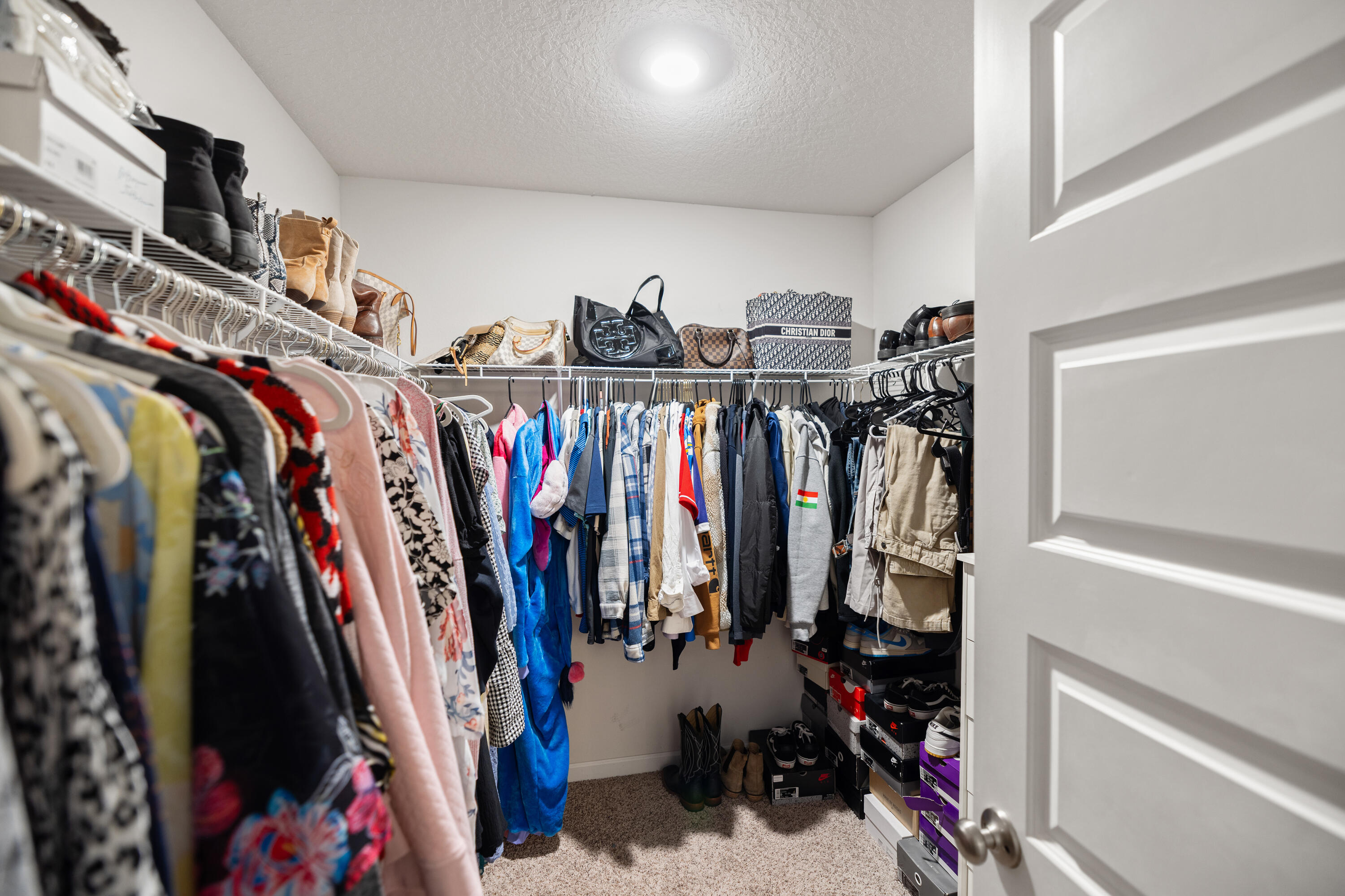 211 Laurel Hill Street Crestview, FL 32539 - Photo 29 of 60 a view of walk in closet with clothes