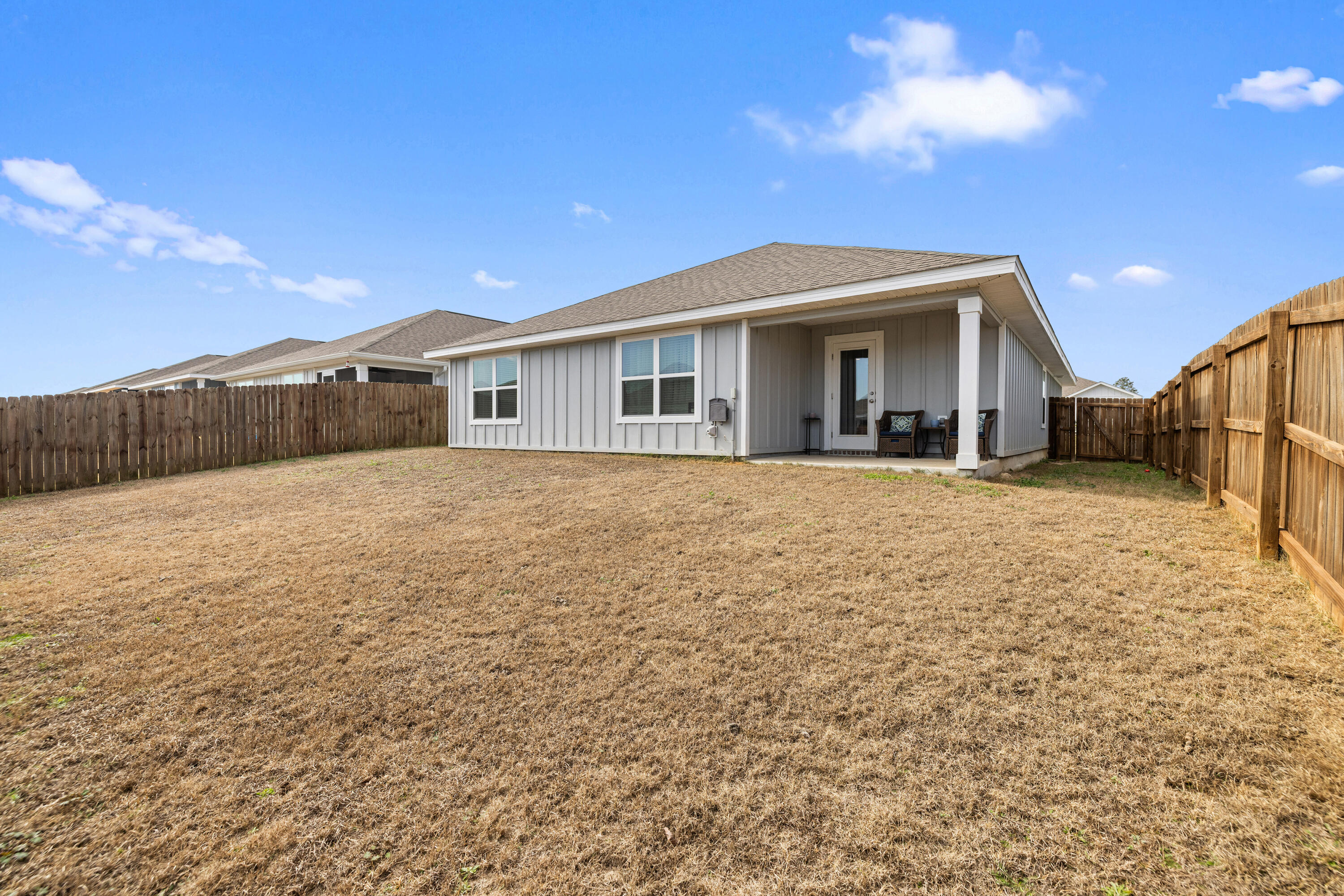 211 Laurel Hill Street Crestview, FL 32539 - Photo 47 of 60 a view of a house with a yard