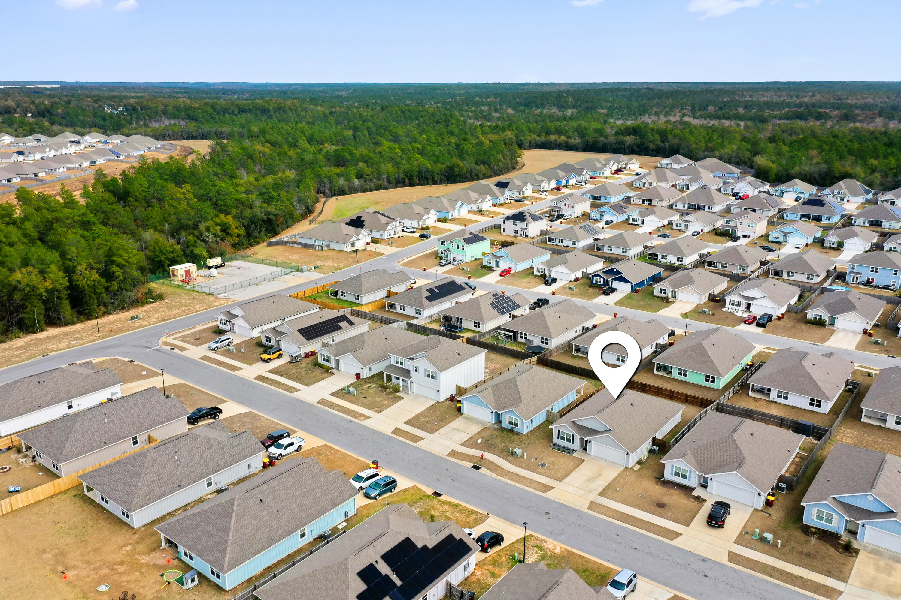 211 Laurel Hill Street Crestview, FL 32539 - Photo 54 of 60 an aerial view of a house with a garden