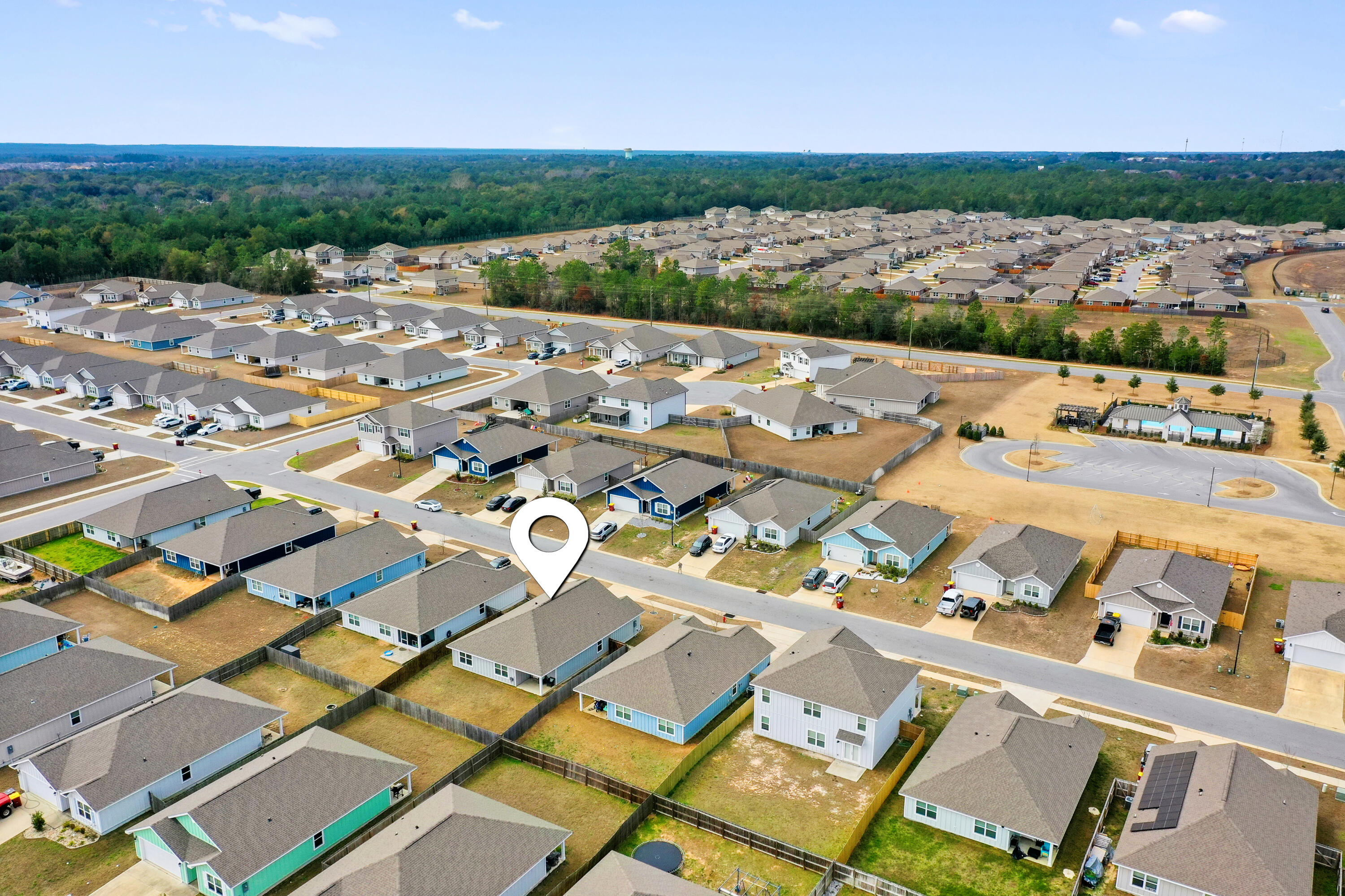 211 Laurel Hill Street Crestview, FL 32539 - Photo 57 of 60 an aerial view of a house with a lake view