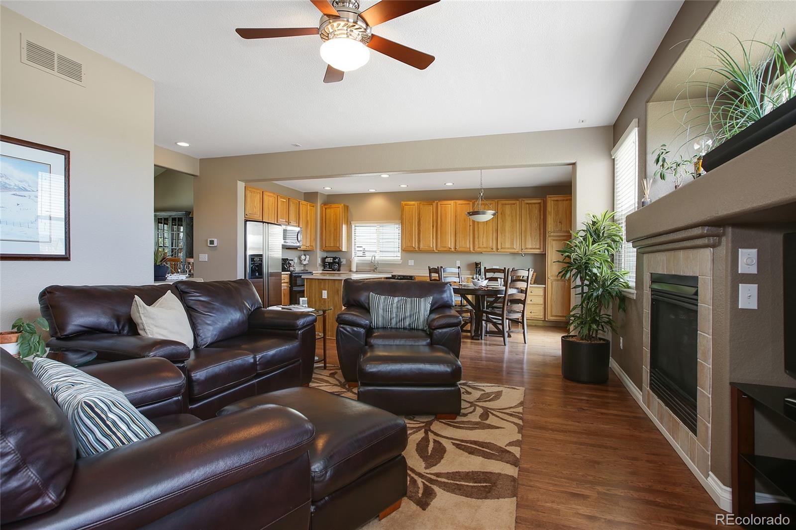 10274 Willowbridge Court Highlands Ranch, CO 80126 - Photo 12 of 35 a living room with furniture and a large window