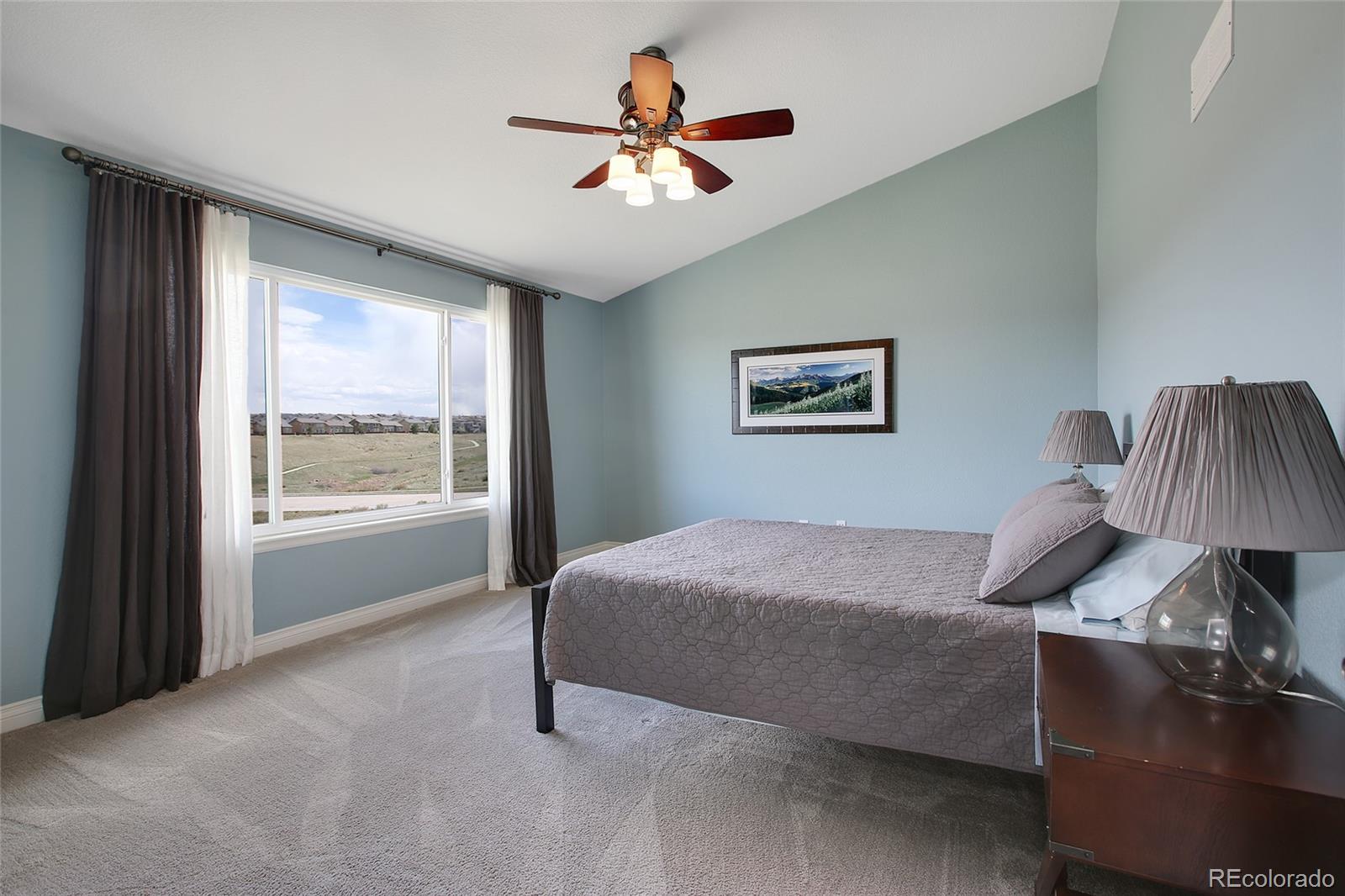 10274 Willowbridge Court Highlands Ranch, CO 80126 - Photo 20 of 35 a bed room with a bed and a window