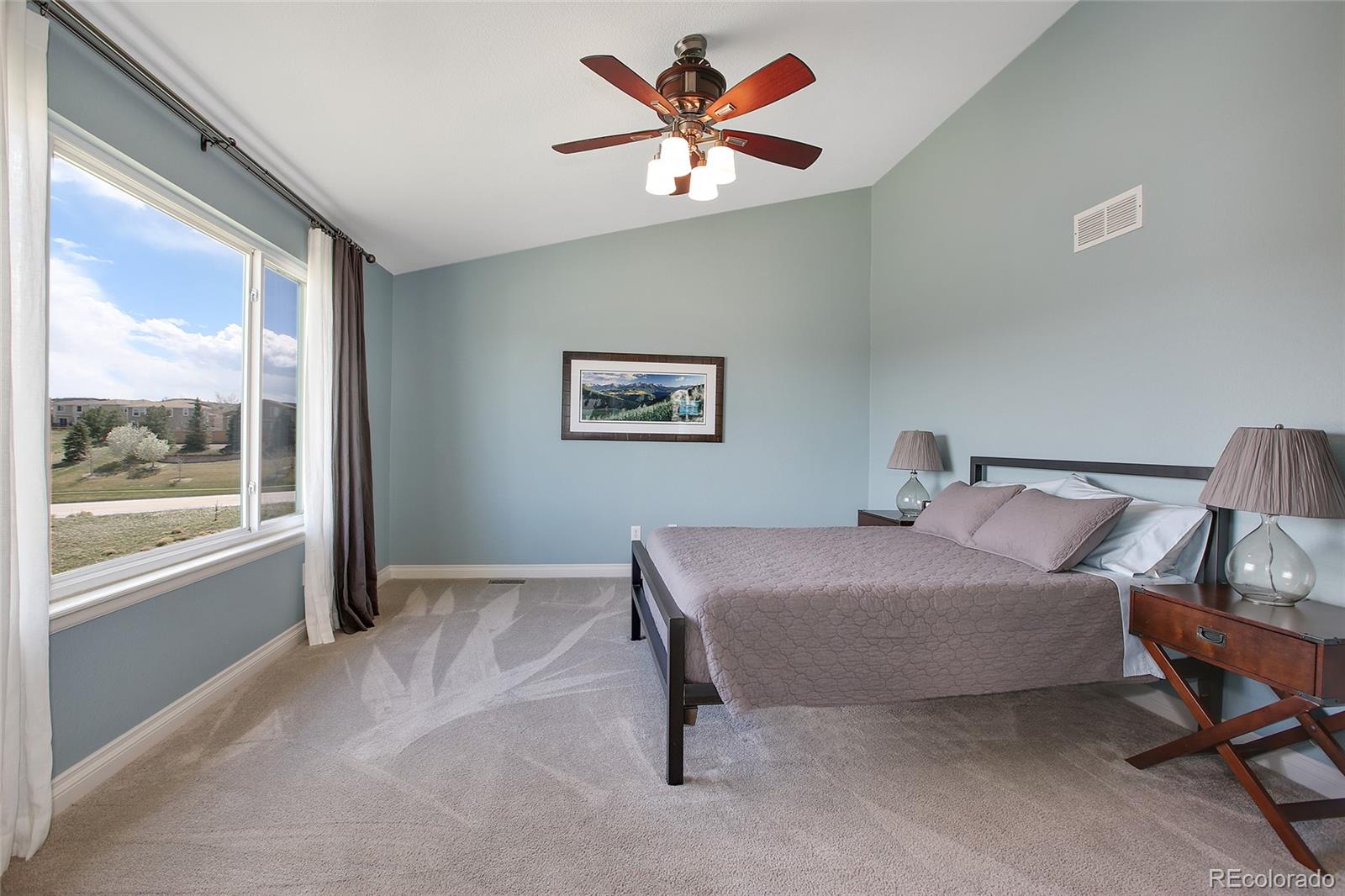 10274 Willowbridge Court Highlands Ranch, CO 80126 - Photo 21 of 35 a bedroom with a bed and a large window