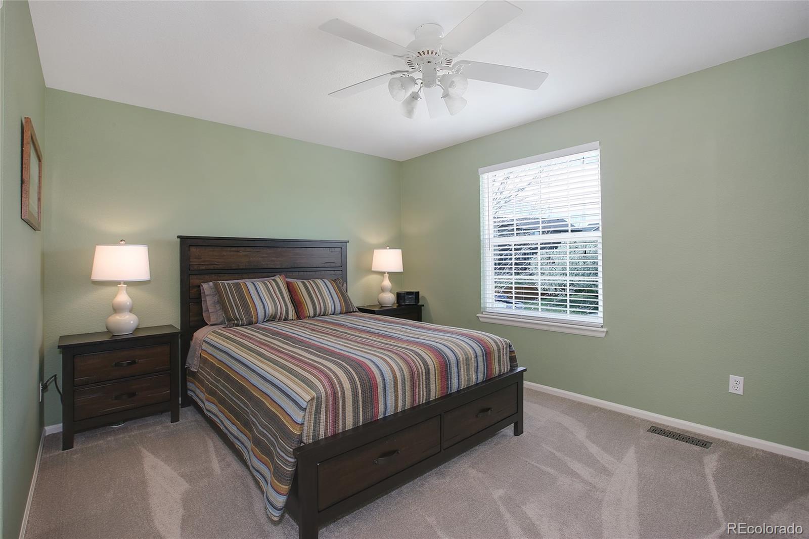 10274 Willowbridge Court Highlands Ranch, CO 80126 - Photo 22 of 35 a bedroom with a bed and a window
