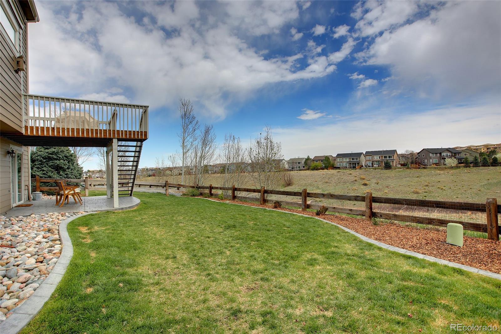 10274 Willowbridge Court Highlands Ranch, CO 80126 - Photo 34 of 35 a view of a garden with an outdoor seating