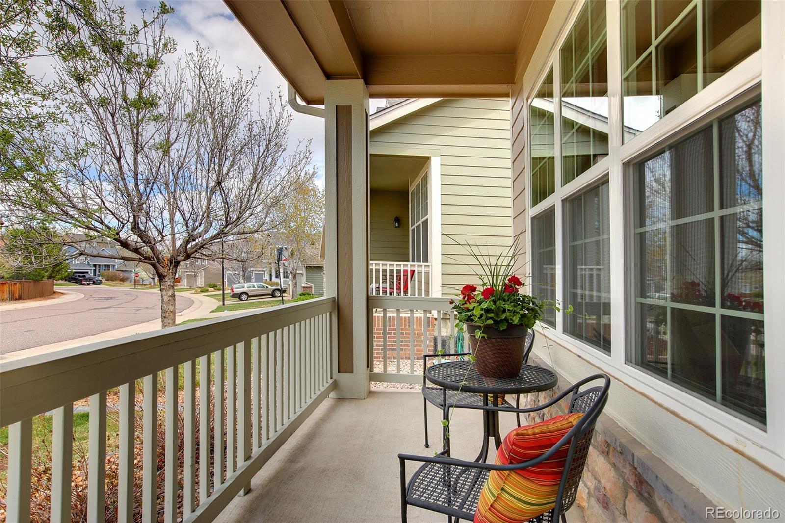 10274 Willowbridge Court Highlands Ranch, CO 80126 - Photo 4 of 35 a view of a chair and table in the balcony