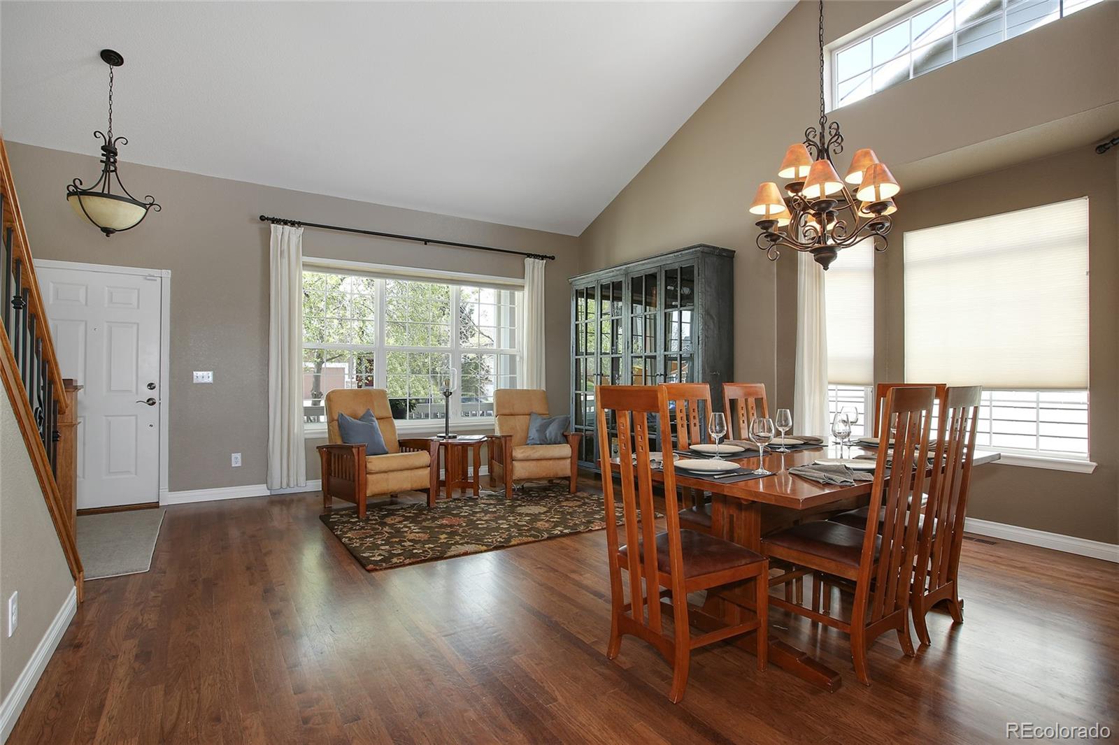 10274 Willowbridge Court Highlands Ranch, CO 80126 - Photo 7 of 35 a view of a dining room with furniture window and wooden floor