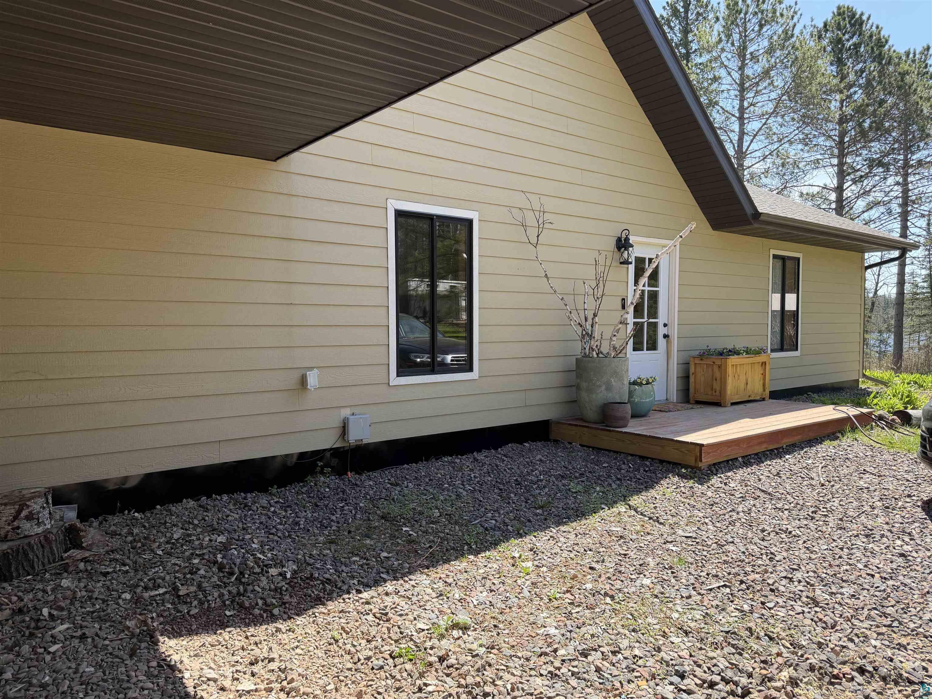 5274 Marble Lake Road Two Harbors, MN 55616 - Photo 64 of 79 Exterior siding in a neutral tone with white trim windows