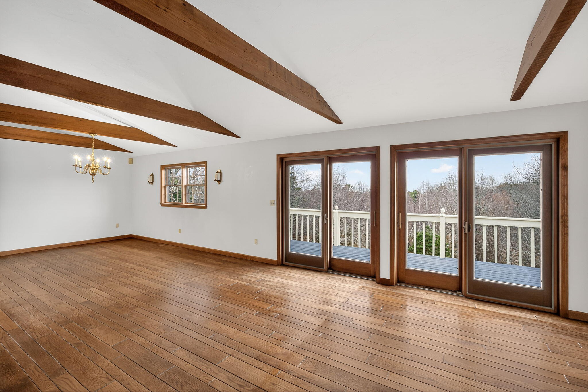 4 Earl Road East Sandwich, MA 02537 - Photo 12 of 63 a view of an empty room with wooden floor and a window