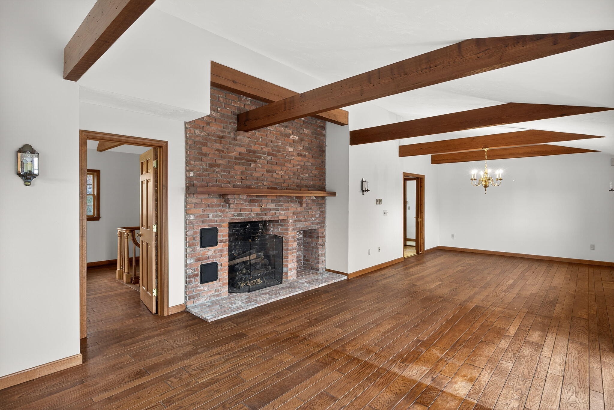 4 Earl Road East Sandwich, MA 02537 - Photo 14 of 63 a view of a livingroom with wooden floor and a fireplace