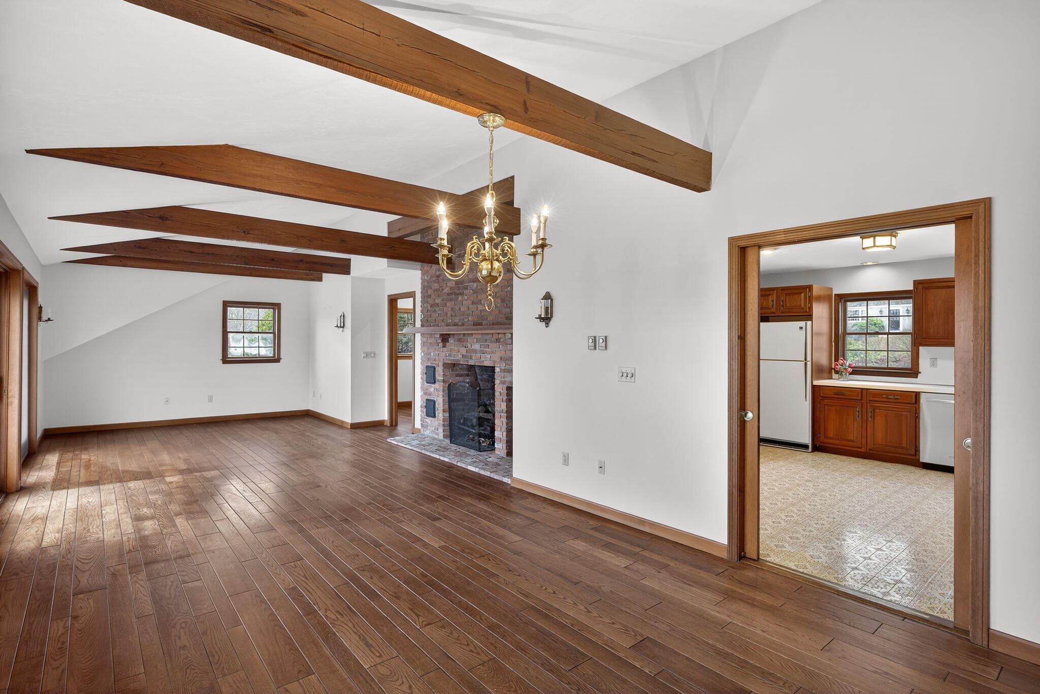 4 Earl Road East Sandwich, MA 02537 - Photo 15 of 63 a view of a hallway with wooden floor and a living room