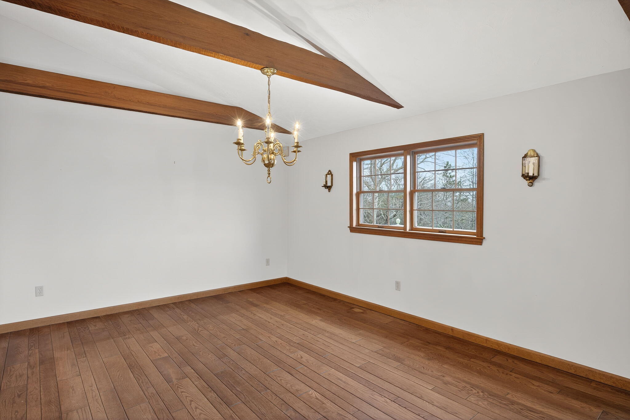 4 Earl Road East Sandwich, MA 02537 - Photo 19 of 63 a view of empty room with wooden floor and fan