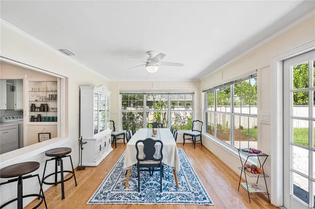 a view of a dining room with furniture window and outside view