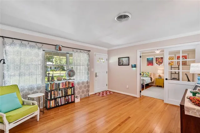 a view of a swimming pool with a patio and a yard