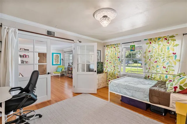 a view of a dining room with furniture and a window