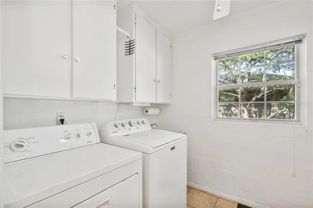 an aerial view of a house with outdoor space and a lake view