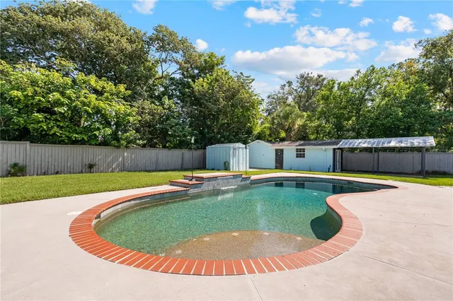 a house view with a sitting space and garden