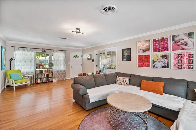 a view of swimming pool with outdoor seating and plants