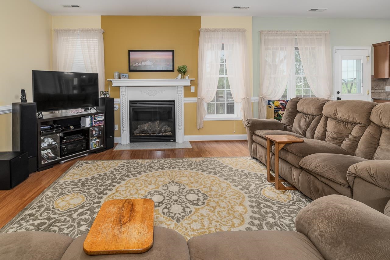 1733 Ridge Road Raphine, VA 24472 - Photo 11 of 32 a living room with furniture a flat screen tv and a fireplace