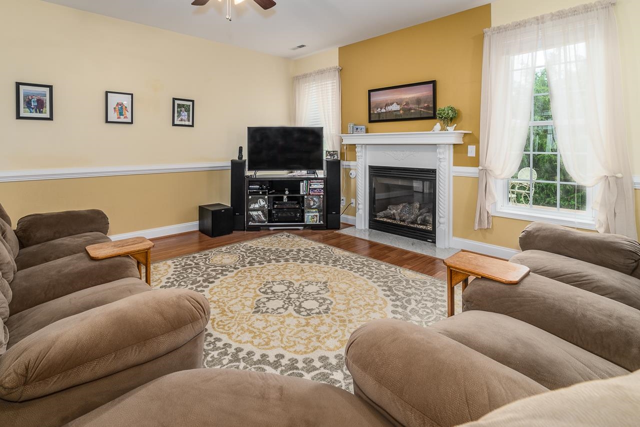 1733 Ridge Road Raphine, VA 24472 - Photo 12 of 32 a living room with furniture a flat screen tv and a fireplace