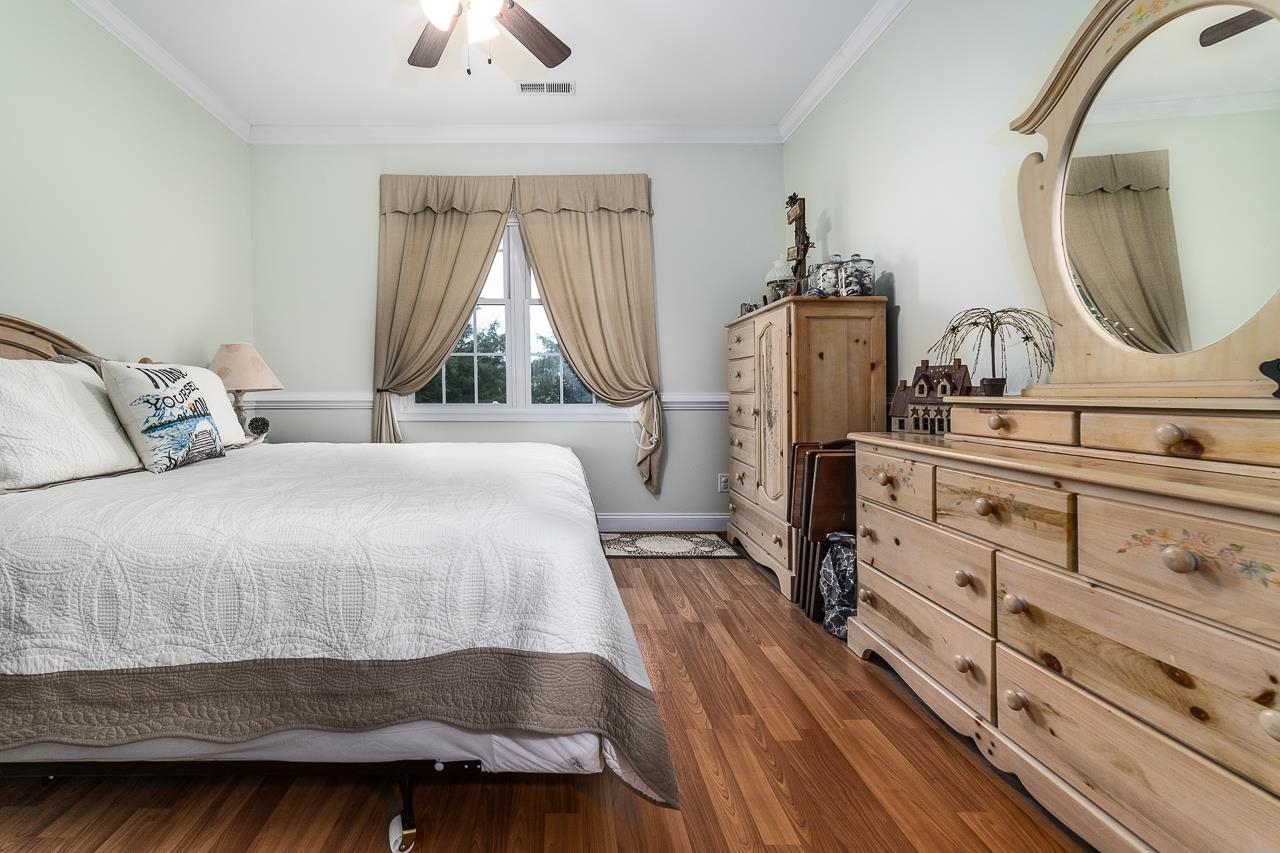 1733 Ridge Road Raphine, VA 24472 - Photo 17 of 32 a bedroom with a bed and a mirror