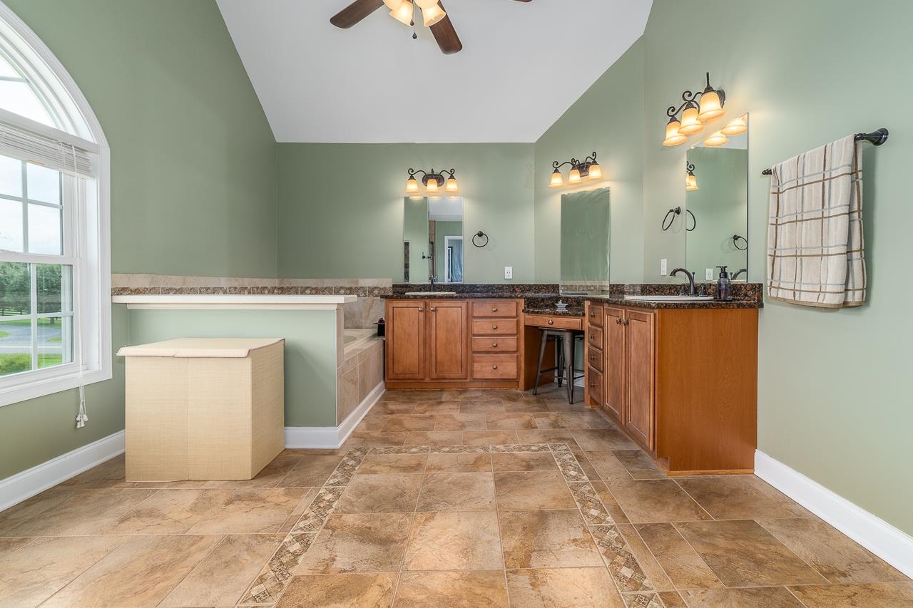 1733 Ridge Road Raphine, VA 24472 - Photo 21 of 32 a large kitchen with granite countertop a stove a sink dishwasher and a refrigerator