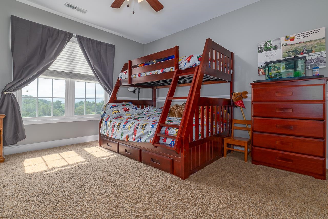 1733 Ridge Road Raphine, VA 24472 - Photo 25 of 32 a bedroom with a bed and a window