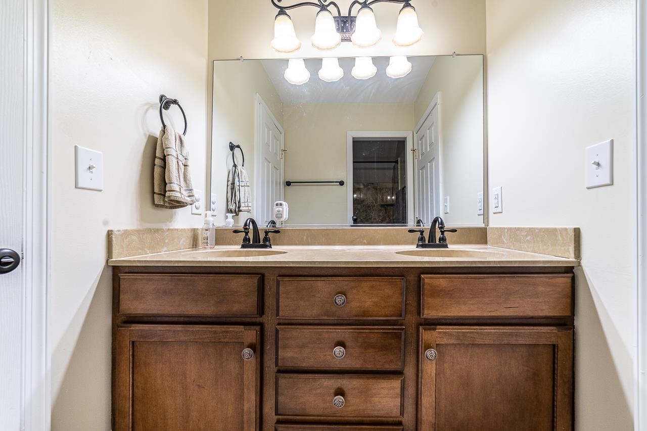 1733 Ridge Road Raphine, VA 24472 - Photo 27 of 32 a bathroom with a sink and a mirror