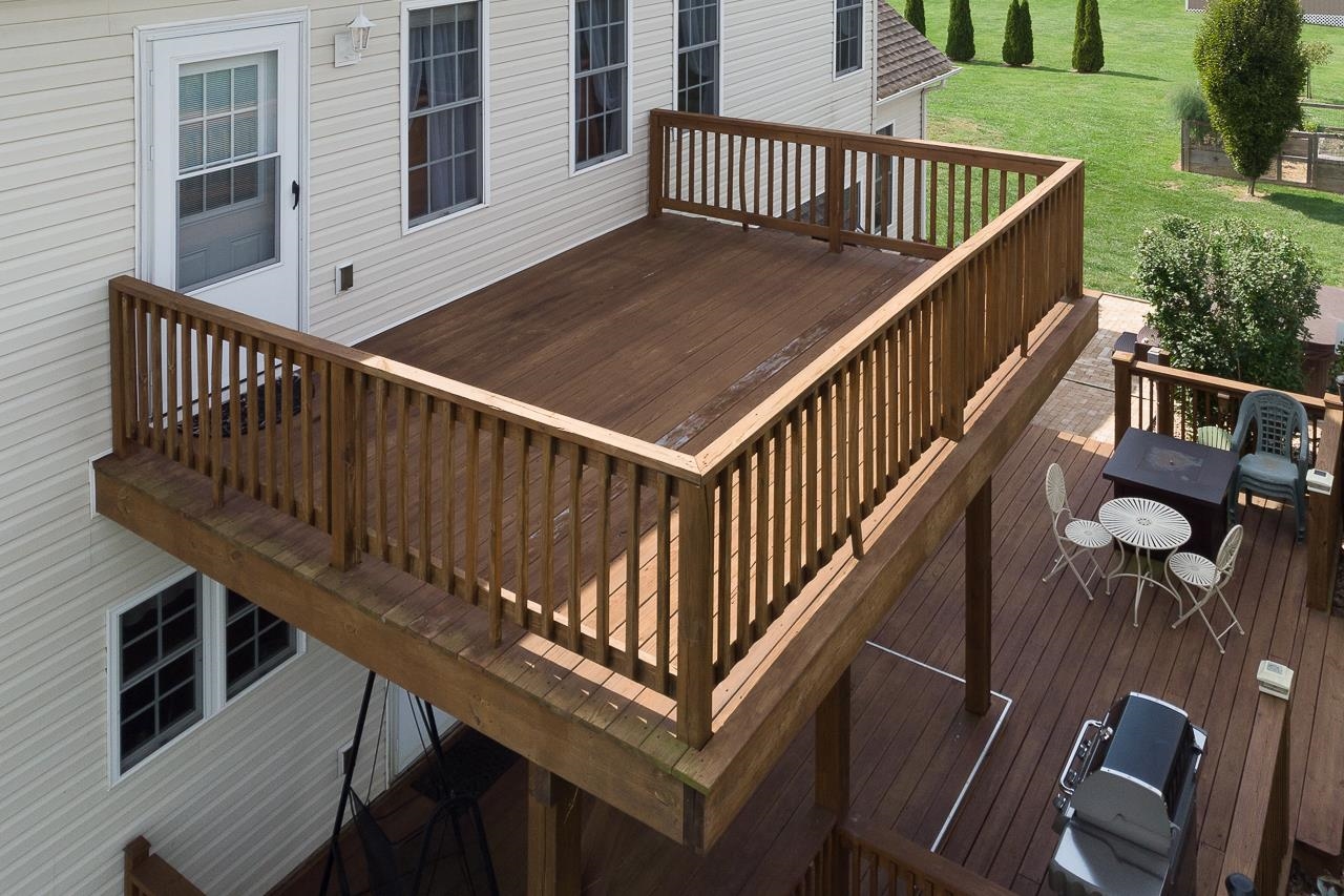 1733 Ridge Road Raphine, VA 24472 - Photo 29 of 32 a balcony of a house with wooden floor stairs and wooden floor