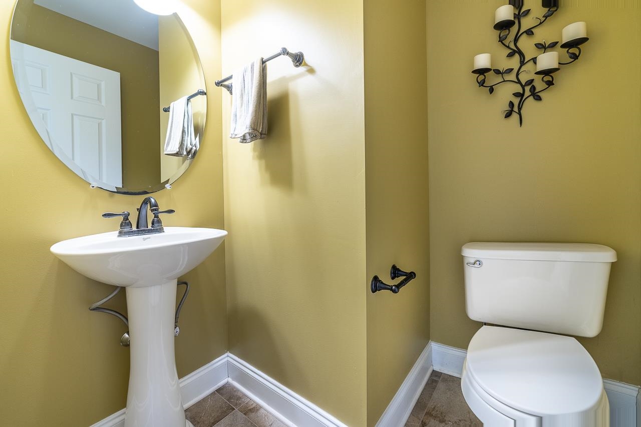 1733 Ridge Road Raphine, VA 24472 - Photo 10 of 32 a bathroom with a toilet sink and mirror