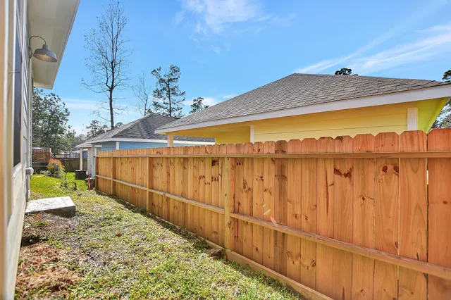 a view of a balcony with wooden fence
