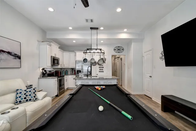 a large room with kitchen view