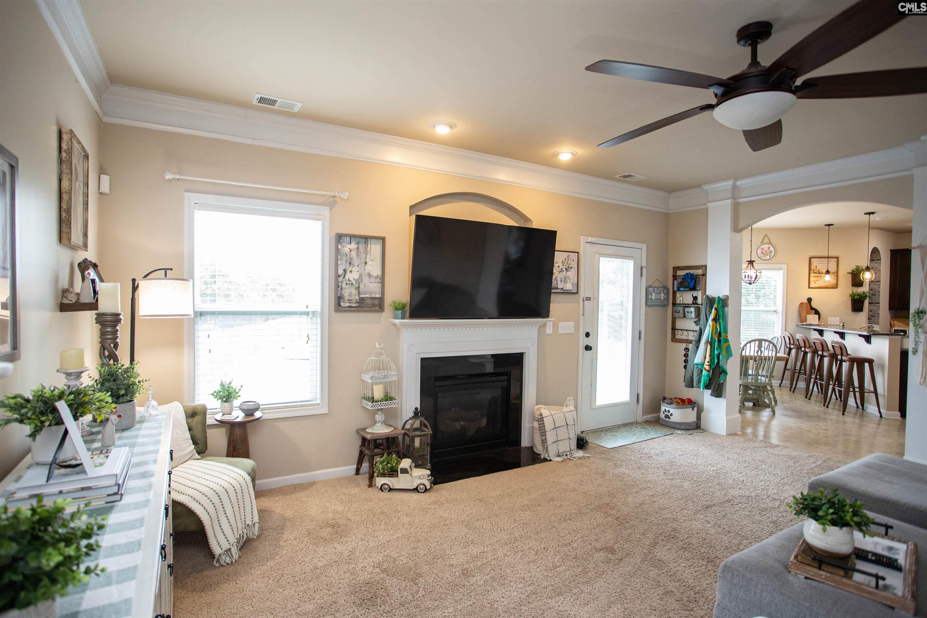7 Templand Court Elgin, SC 29045 - Photo 20 of 47 a living room with furniture and a fireplace