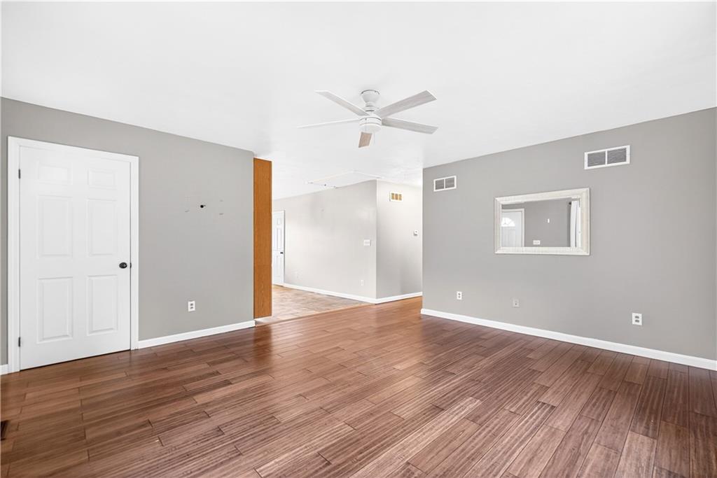 1270 Mudlick Hollow Road Beaver, PA 15009 - Photo 11 of 49 Neutral decor, ceiling fan, coat closet, and gleaming hardwoods.