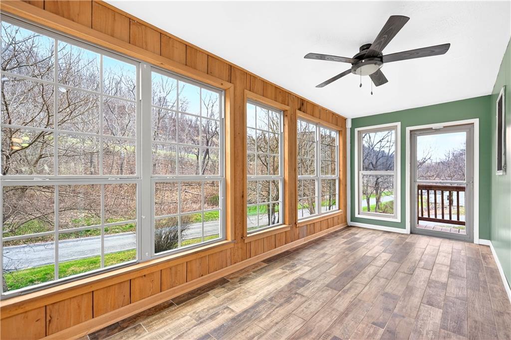 1270 Mudlick Hollow Road Beaver, PA 15009 - Photo 13 of 49 Gorgeous sunroom with a wall of windows to enjoy nature.