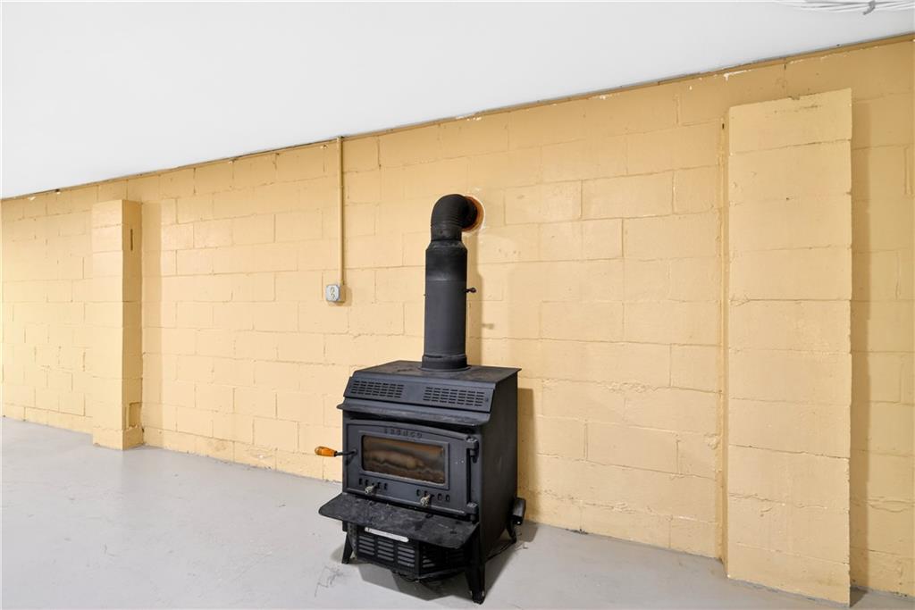 1270 Mudlick Hollow Road Beaver, PA 15009 - Photo 29 of 49 Wood burner is the focul point in the lower level.