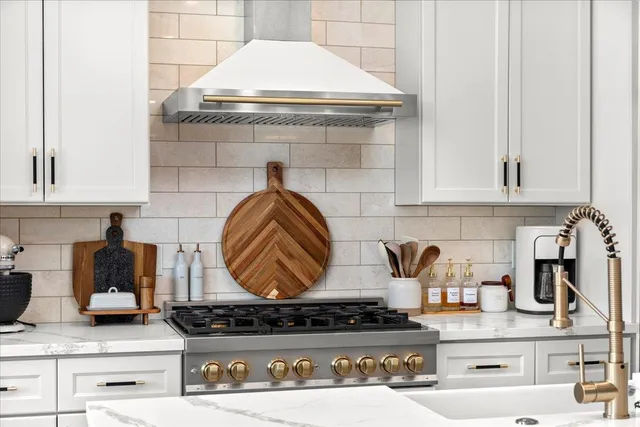 a kitchen with a stove and cabinets