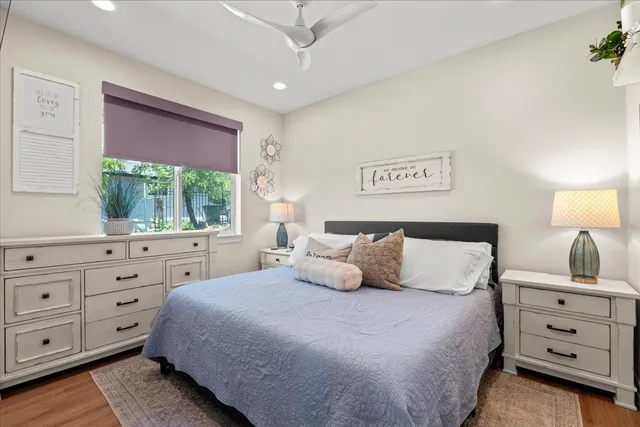 a bedroom with a bed and a window