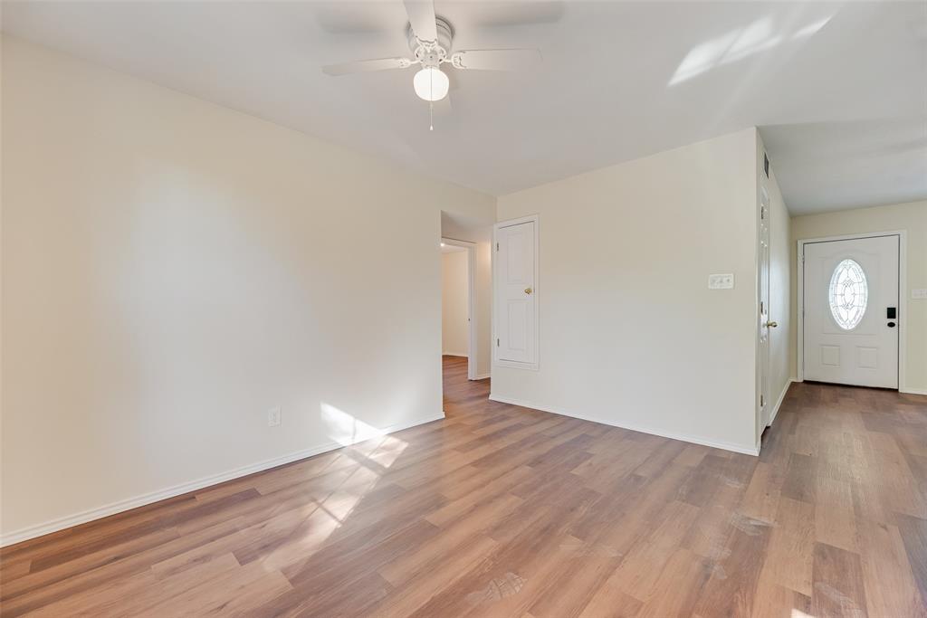 751 County Road 1240 Mount Pleasant, TX 75455 - Photo 13 of 35 an empty room with wooden floor and windows