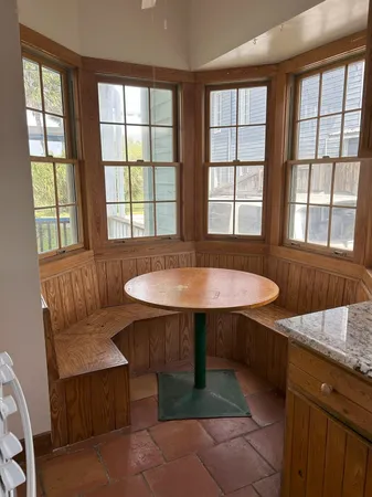 a view of a house with brick walls and wooden floor